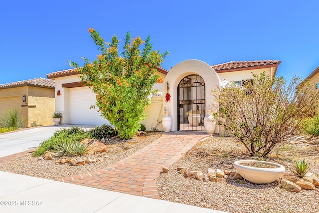 mediterranean / spanish-style house featuring a garage