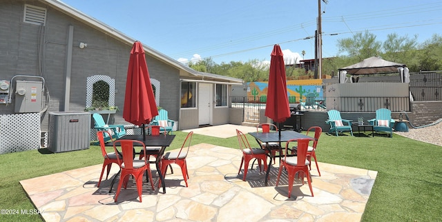 view of patio with a gazebo and cooling unit