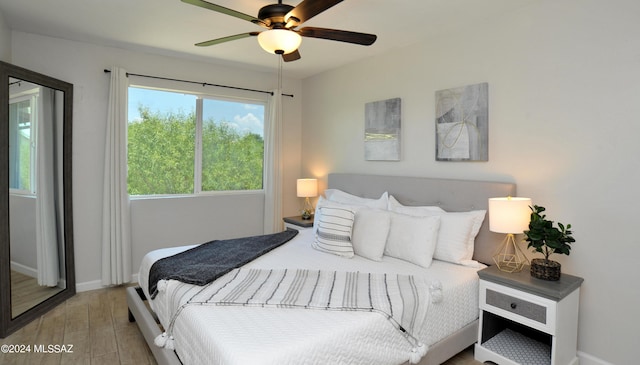 bedroom featuring ceiling fan and light wood-type flooring