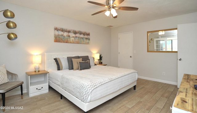 bedroom featuring hardwood / wood-style floors and ceiling fan