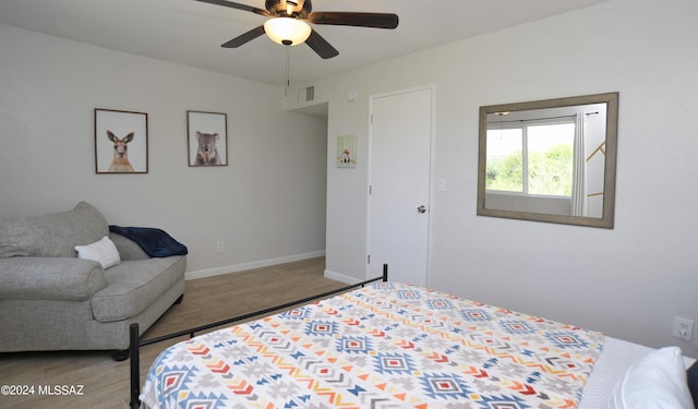 bedroom featuring ceiling fan and hardwood / wood-style floors