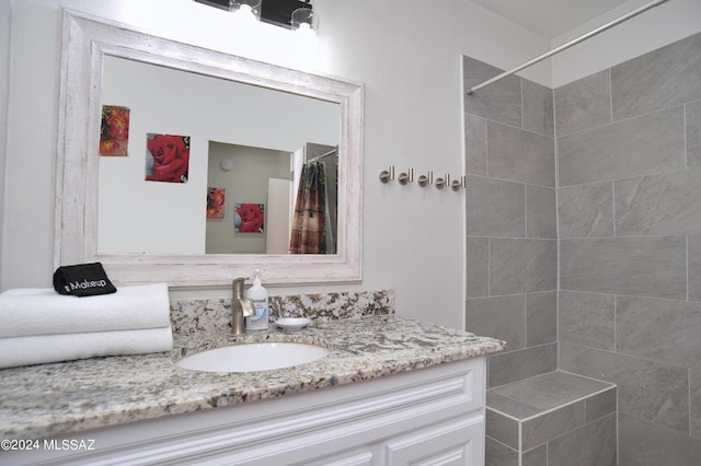 bathroom with vanity and curtained shower