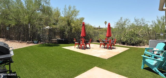 view of yard featuring a patio and central AC unit