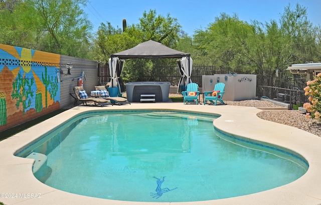 view of pool with a gazebo, a hot tub, and a patio