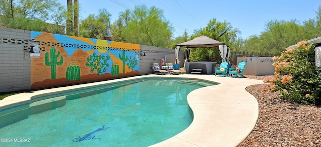 view of pool with a gazebo, a patio, and a jacuzzi