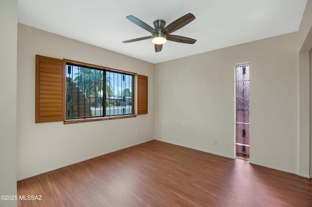 empty room featuring ceiling fan and wood-type flooring