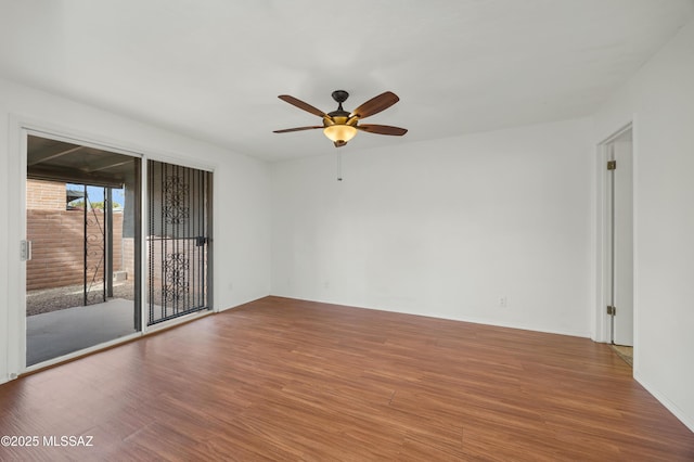 spare room featuring ceiling fan and wood-type flooring