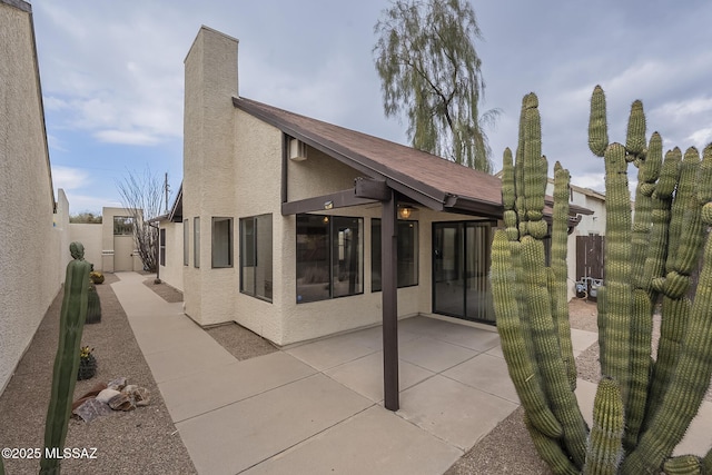 back of house featuring a patio area