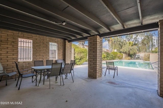 view of patio featuring a fenced in pool