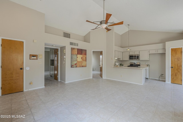 unfurnished living room featuring ceiling fan, high vaulted ceiling, and light tile patterned floors