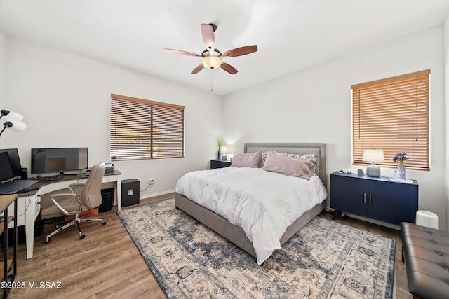 bedroom featuring hardwood / wood-style flooring and ceiling fan