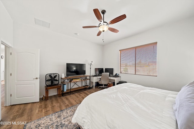 bedroom with wood-type flooring and ceiling fan