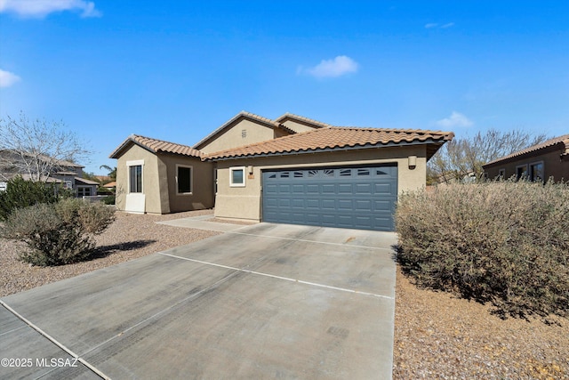 mediterranean / spanish house featuring a garage