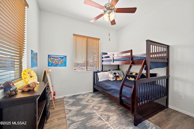 bedroom featuring dark wood-type flooring and ceiling fan