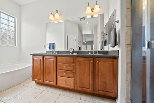 bathroom with tile patterned flooring, vanity, and plus walk in shower