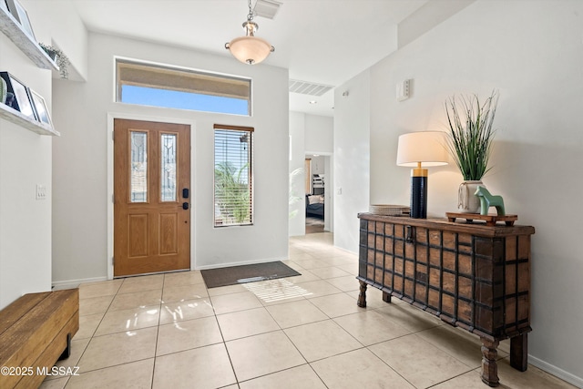 foyer with light tile patterned flooring