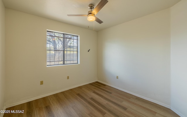 unfurnished room featuring wood-type flooring and ceiling fan