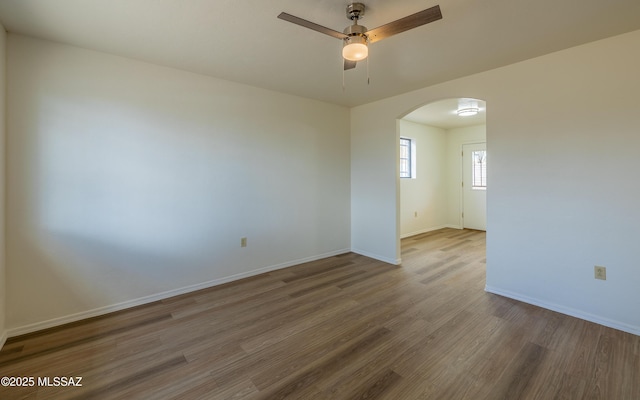 unfurnished room featuring hardwood / wood-style flooring and ceiling fan