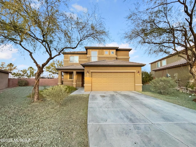 prairie-style house featuring a garage and a front yard