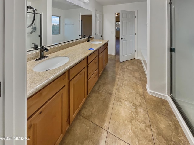 bathroom with vanity, tile patterned floors, and walk in shower