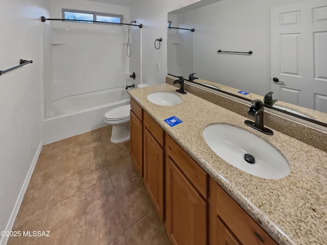 full bathroom featuring vanity, tile patterned floors, toilet, and washtub / shower combination