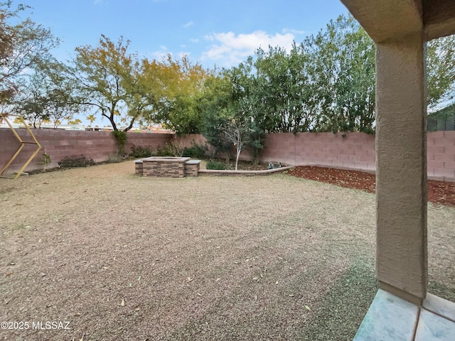 view of yard with a patio area and a fire pit