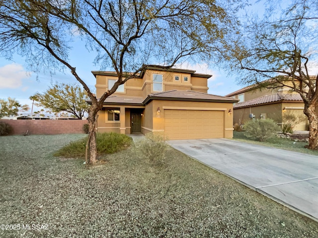 prairie-style house with a garage and a front lawn