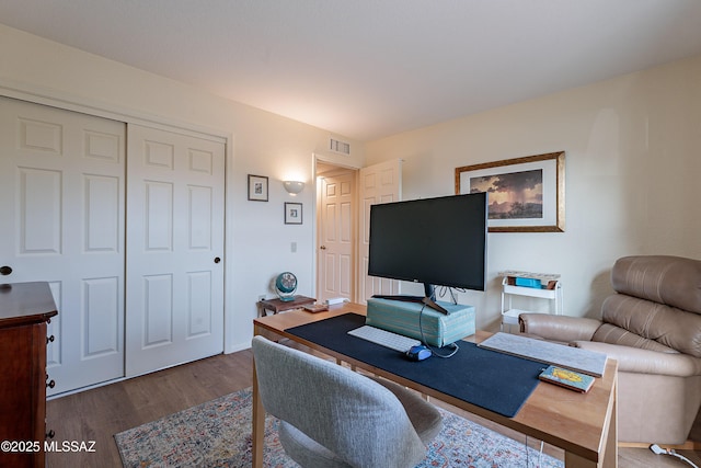 office space with wood-type flooring