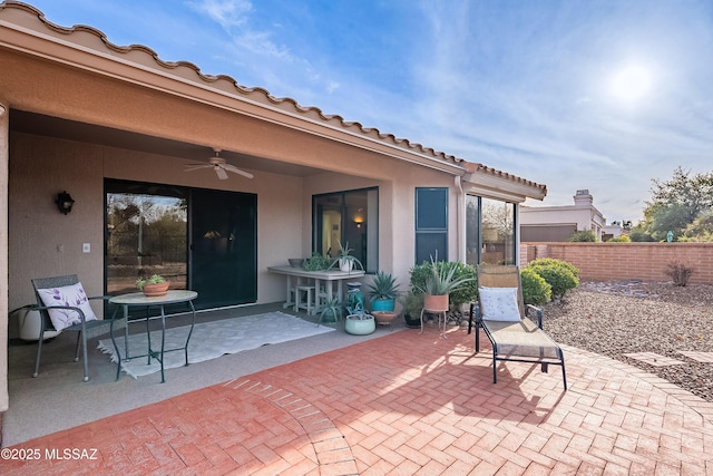 view of patio featuring ceiling fan