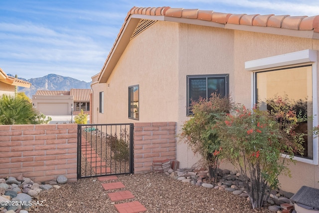 view of home's exterior with a mountain view