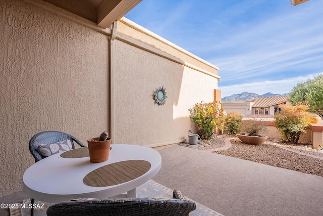 view of patio / terrace with a mountain view