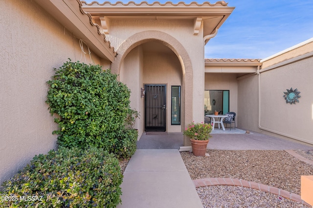 doorway to property featuring a patio area