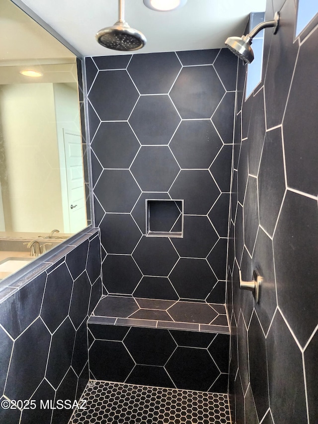 bathroom with a tile shower