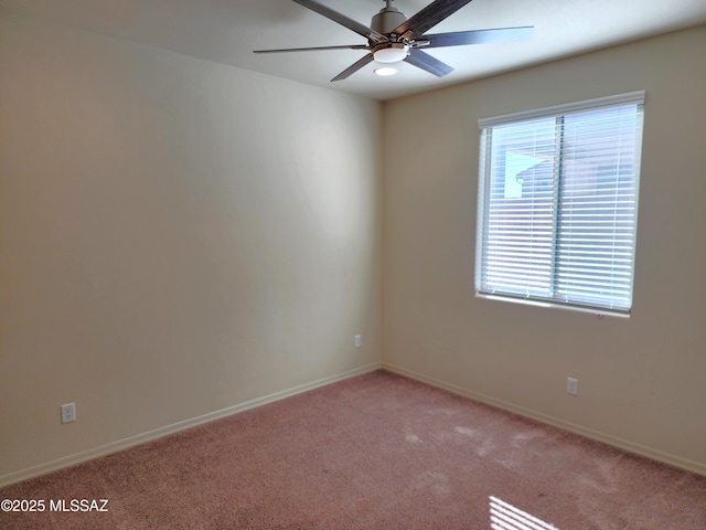 carpeted empty room with ceiling fan