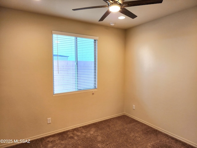 carpeted empty room featuring ceiling fan