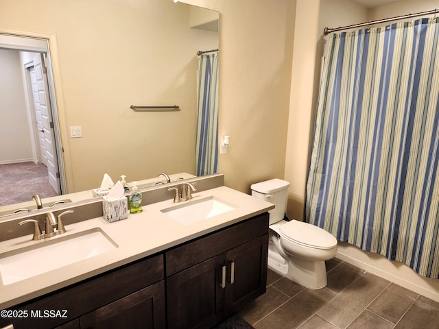 full bathroom featuring shower / bath combination with curtain, vanity, and toilet