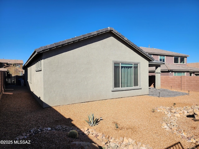 back of property with a patio area