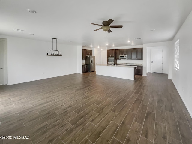 unfurnished living room featuring ceiling fan