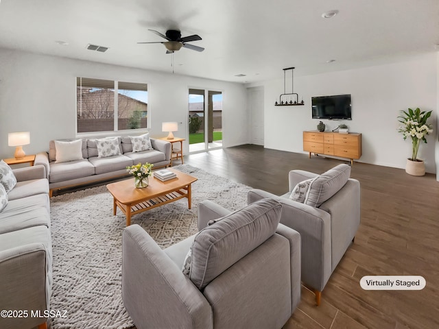 living room with hardwood / wood-style flooring and ceiling fan