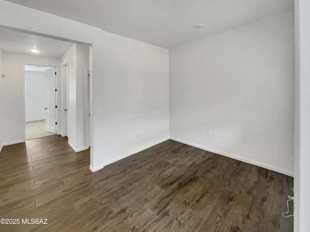 unfurnished room featuring dark hardwood / wood-style floors