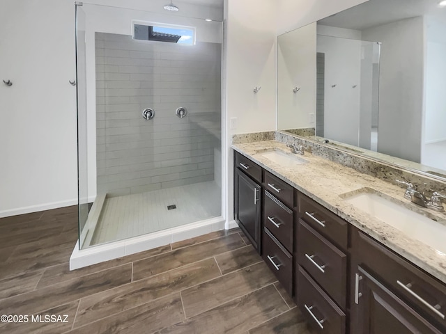 bathroom featuring vanity and a tile shower