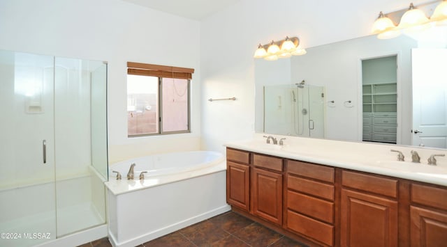 bathroom featuring vanity and independent shower and bath