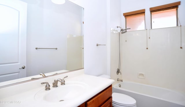 full bathroom featuring vanity, bathtub / shower combination, and toilet