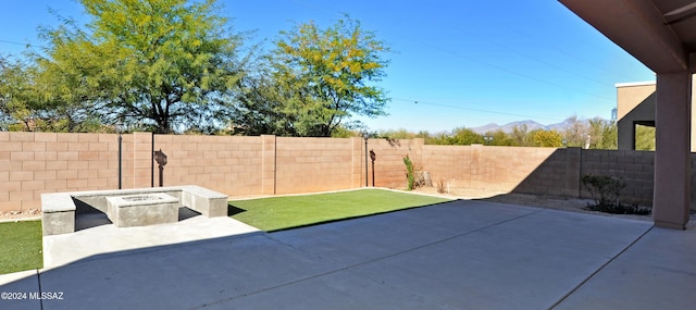 view of patio / terrace with a fire pit