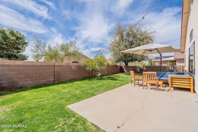 view of yard featuring a patio area, a fenced backyard, and an outdoor hangout area