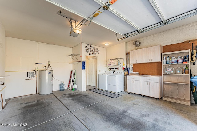 garage featuring a garage door opener, electric water heater, and washing machine and clothes dryer