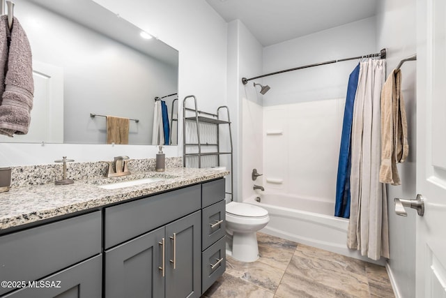 full bathroom with shower / bath combination with curtain, vanity, and toilet