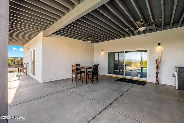 view of patio featuring ceiling fan