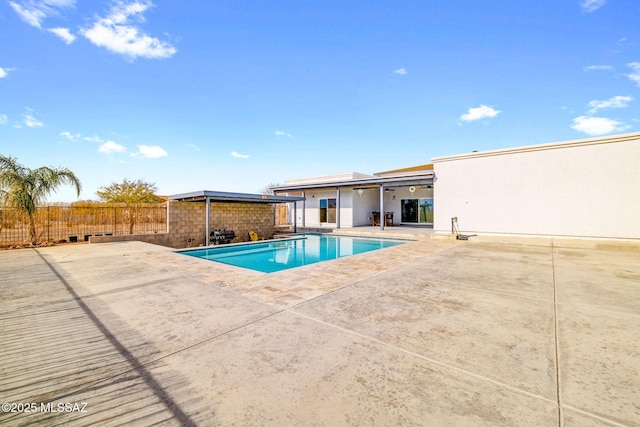 view of swimming pool featuring a patio