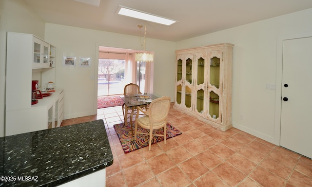 dining area with light tile patterned flooring